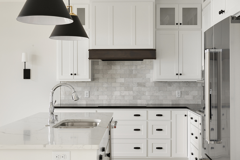 Kitchen with custom white cabinets