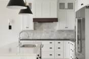 Kitchen with custom white cabinets