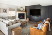 Living room with fireplace and TV